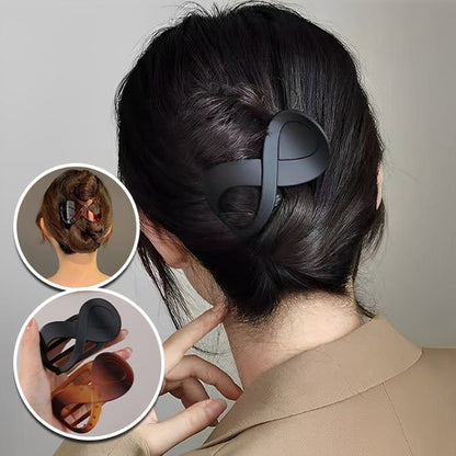 Pince-à-cheveux-forme-infini-noire-chignon-femme-style-minimaliste-moderne
