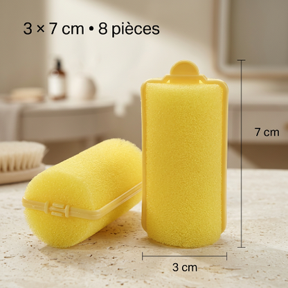 Bigoudis mousse jaunes moyens portes devant le miroir