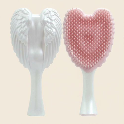 brosse-à-cheveux-démêlante-ailes-rose-fond-beige