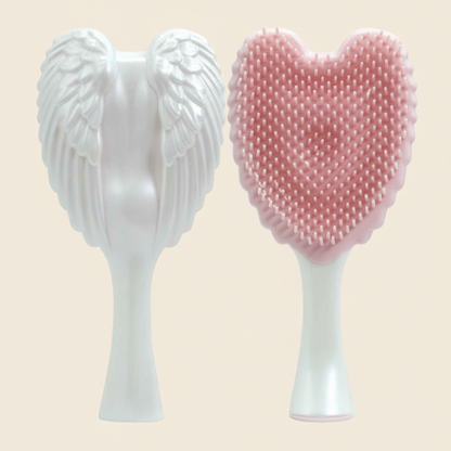 brosse-à-cheveux-démêlante-ailes-rose-fond-beige