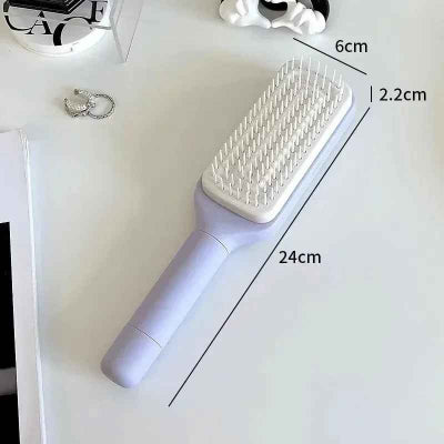 brosse-à-cheveux-violette-une-surface-blanche
