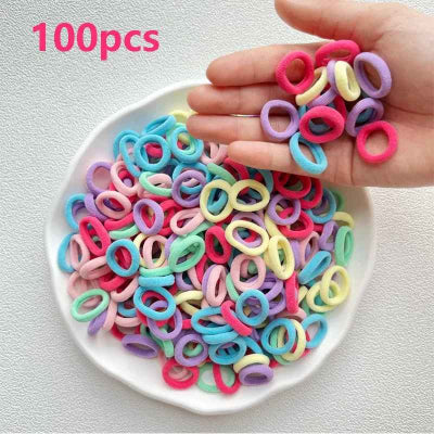 élastique cheveux lot mini elastiques colores pastel sur assiette