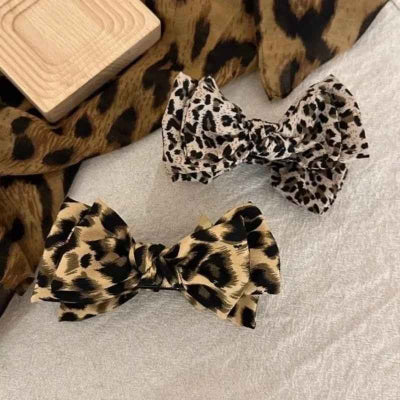 Pince cheveux noeud leopard deux coloris blanc noir beige