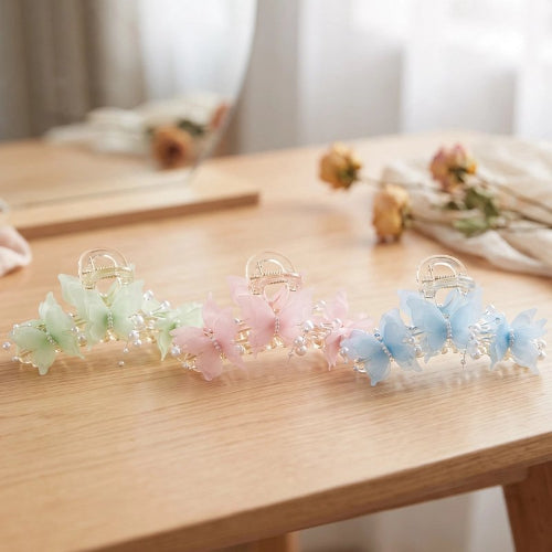 Pince a cheveux papillon transparente avec perles et strass